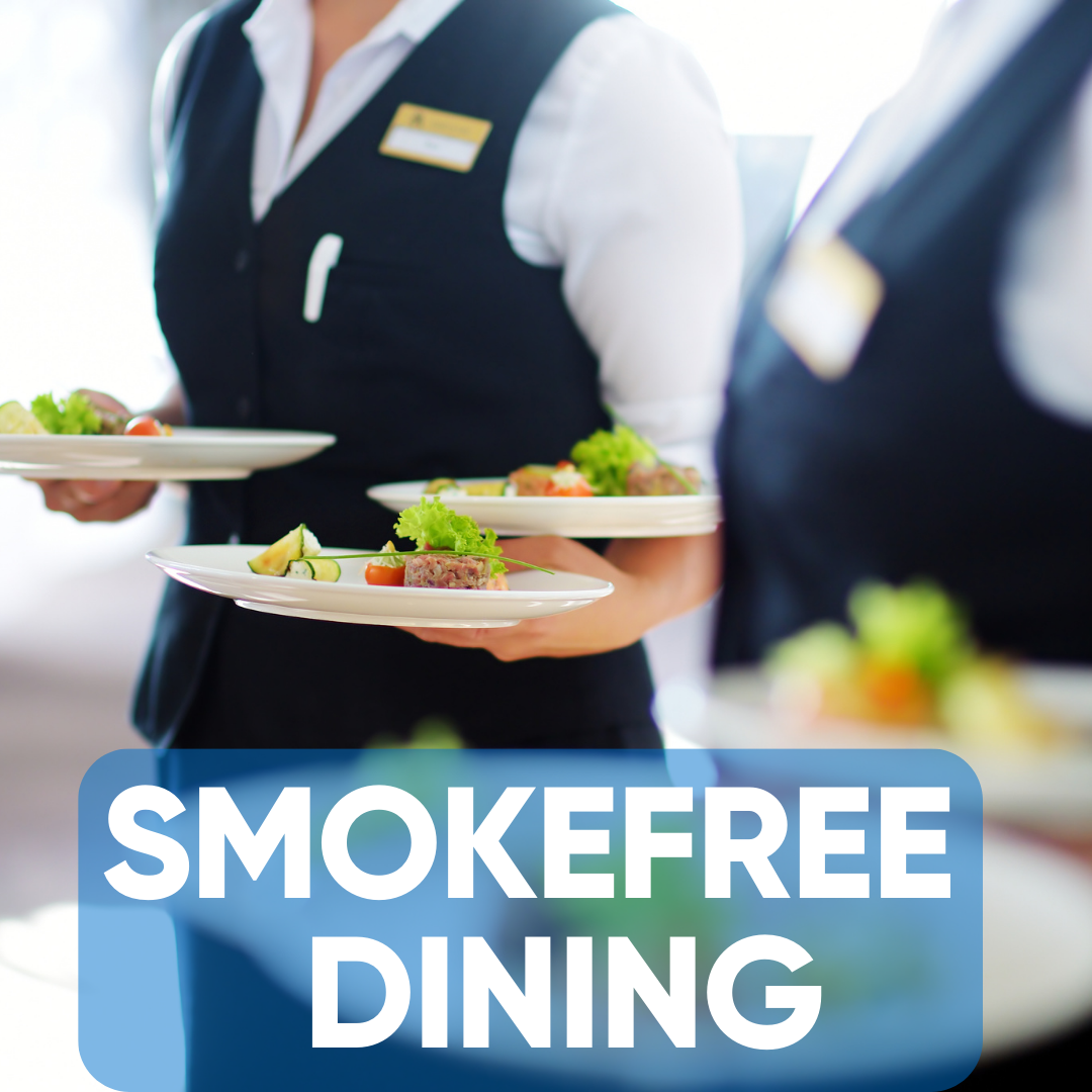 The words, 'Smokefree Dining,' over an image of some fancy meals being carried by waitstaff.